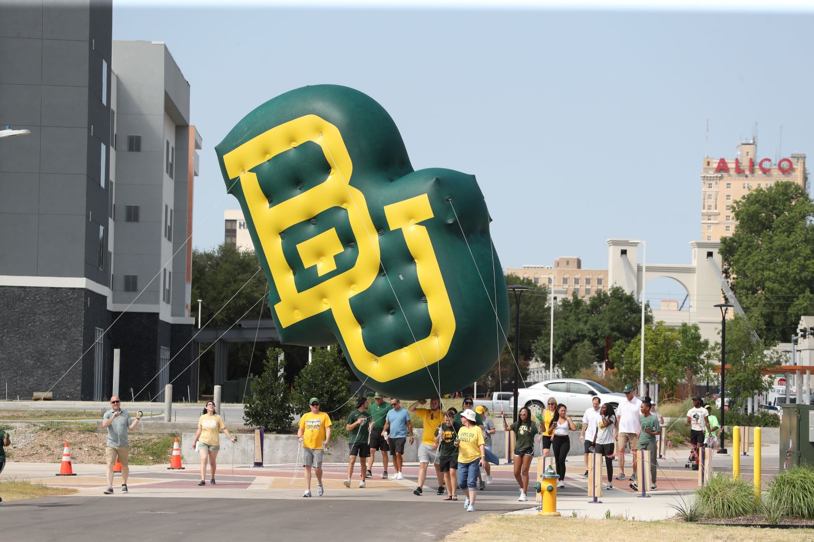 BU blimp being carried in downtown Waco