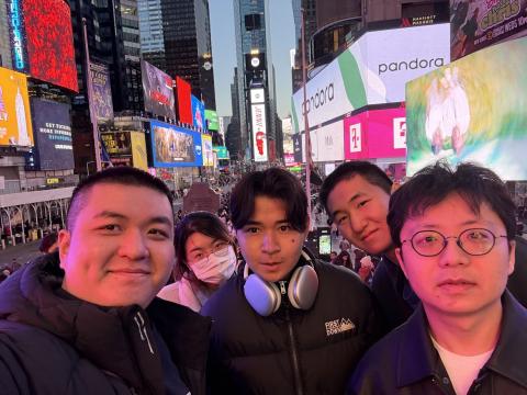 A group of international students take a selfie in Times Square
